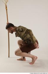 KEETA KNEELING POSE WITH SPEAR